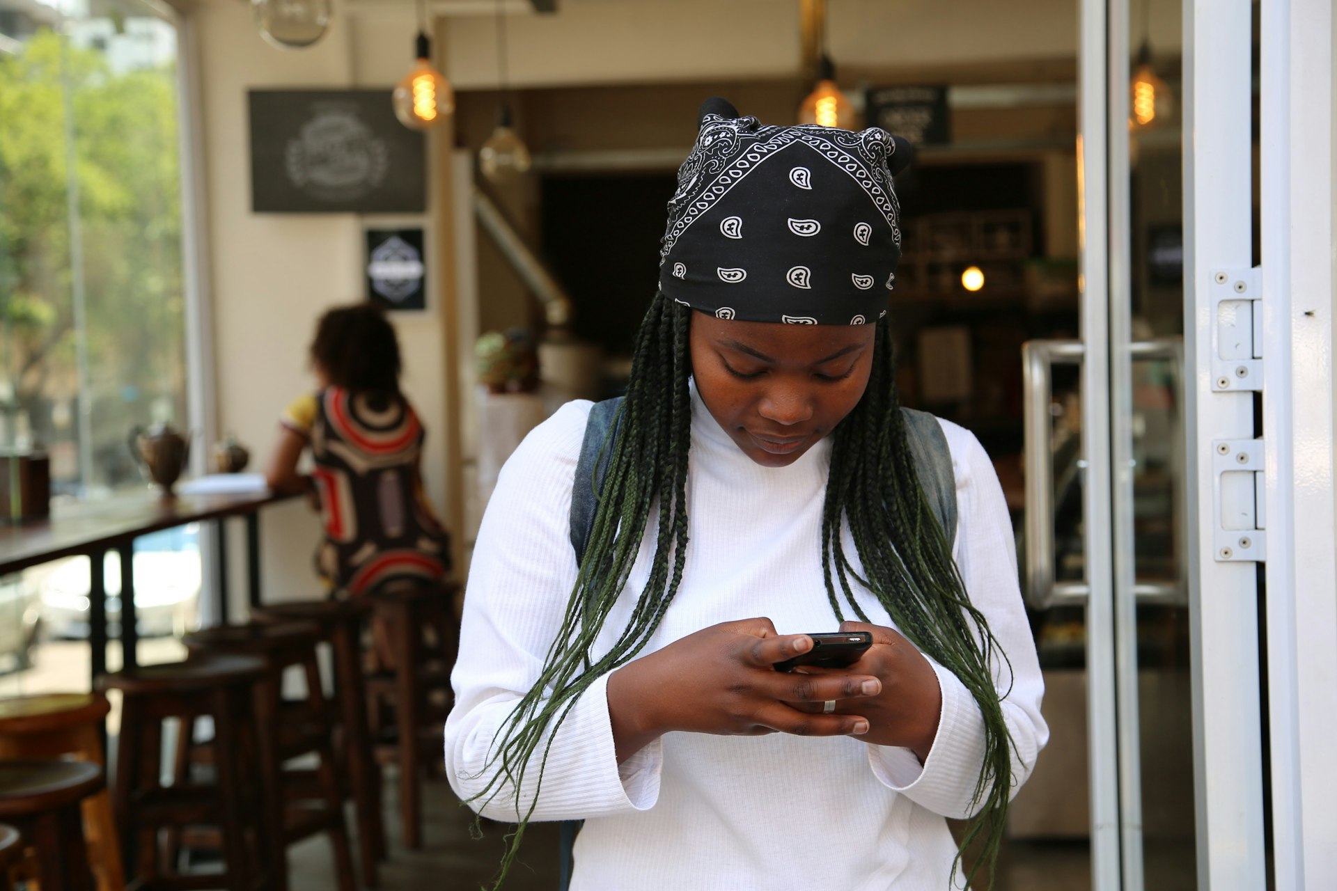 ssd crown voting woman standing while holding black phone voting for ssd crown